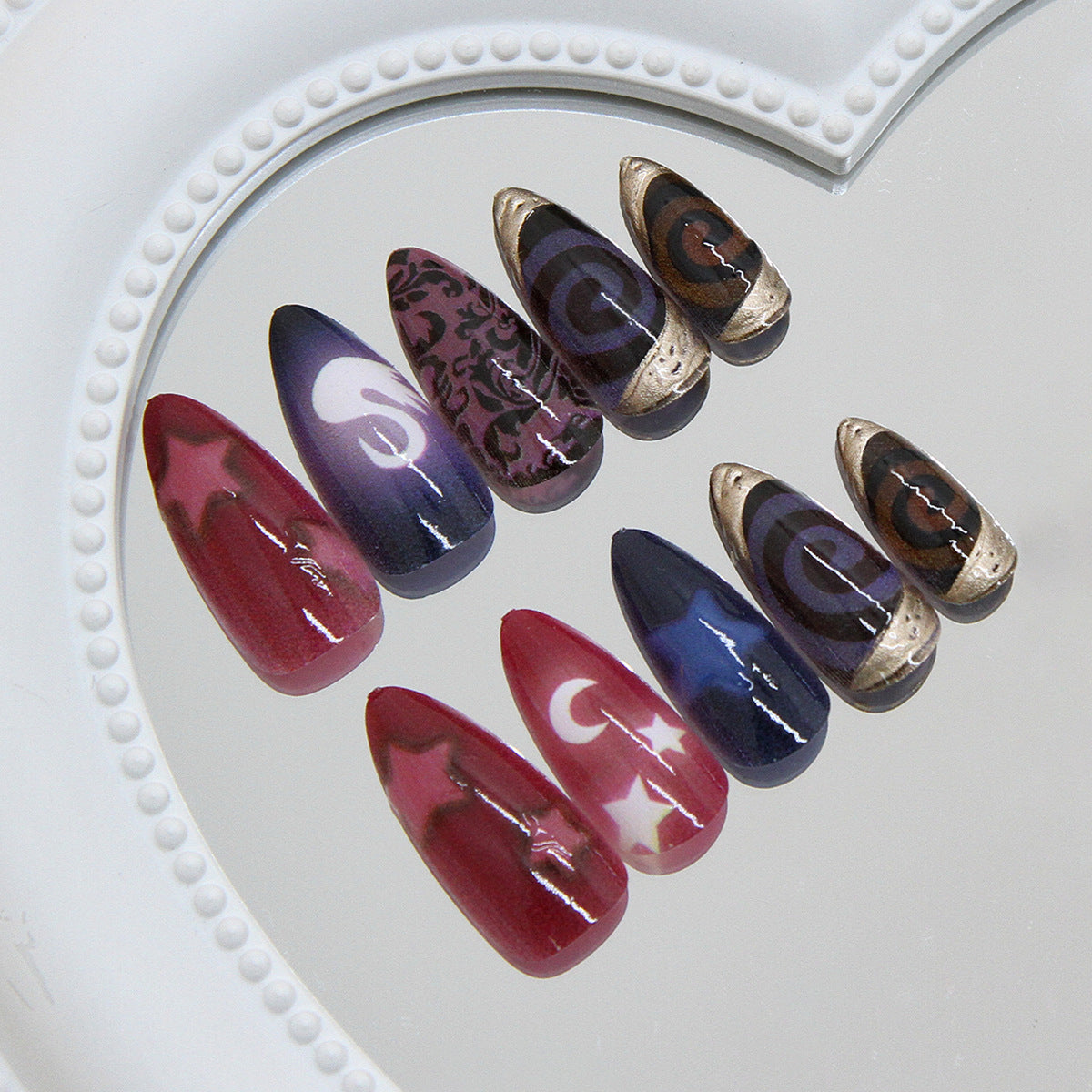 Cosmic Dream Press On Nail Set Long Almond Dark Purple and Red with Celestial Patterns