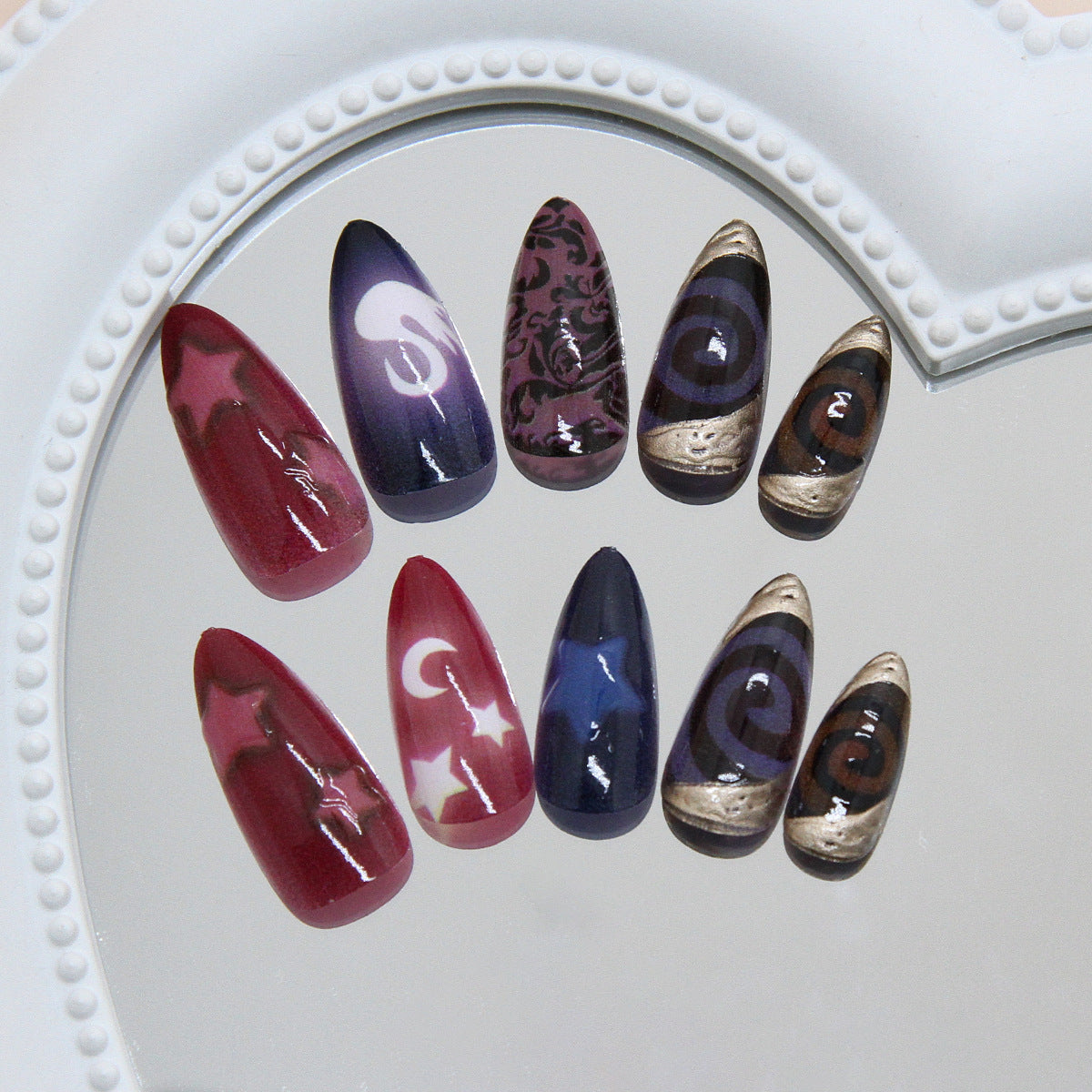Celestial Dreams Long Almond Shaped Burgundy and Purple Gradient Press on Nail Set with Unique Star and Moon Designs