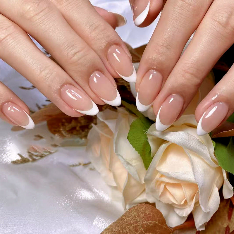 Elegant Blossom Beige Medium Almond Nails Featuring Chic White Tips