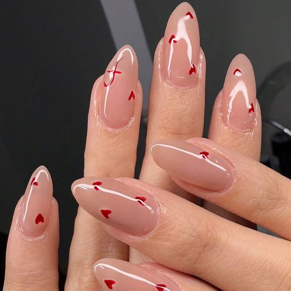 Romantic Heartfelt Long Almond Shaped Beige Nails with Red Heart Accents
