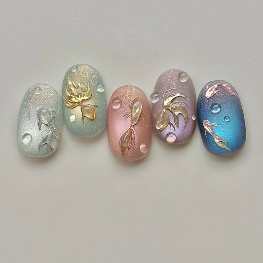 Aquatic Elegance Glossy Short Oval Press On Nail Set in Pastel Green Pink Lavender and Blue with Goldfish Design and Bubble Accents