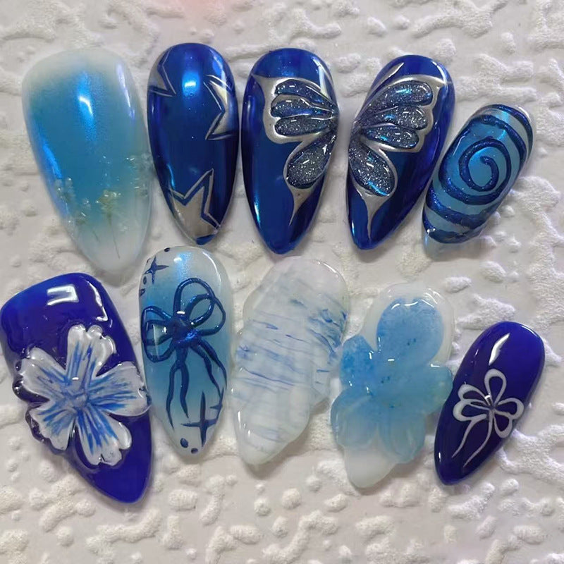 Ocean Breeze Medium Almond Blue Press-On Nail Set with Glittering Floral and Whimsical Designs