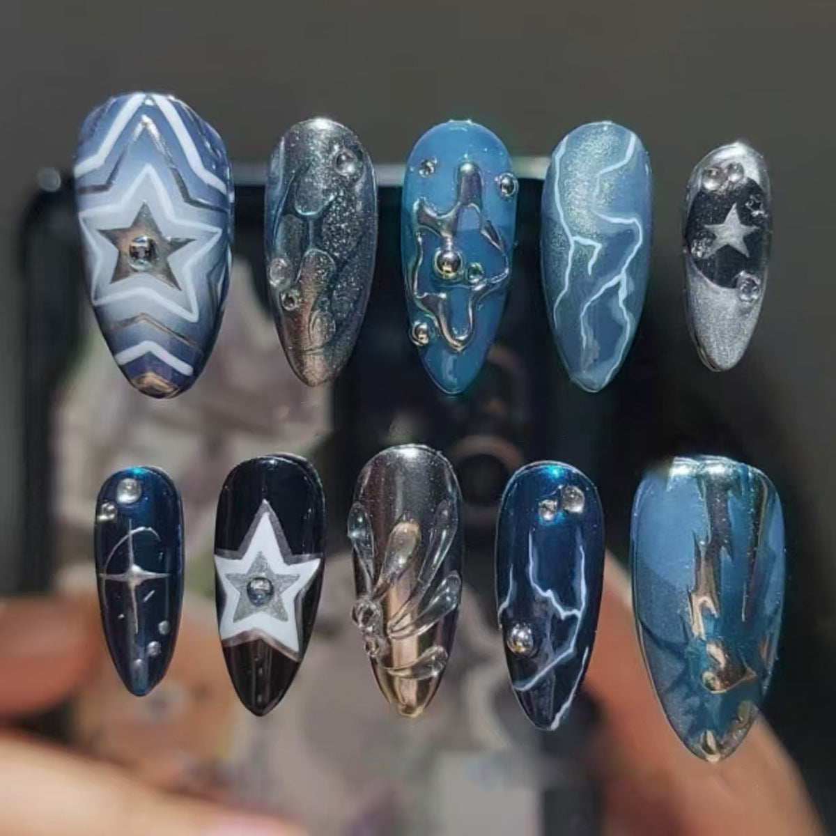 Celestial Night Glossy Long Almond Shaped Deep Blue Starry Nail Set with Unique Shimmering Accents