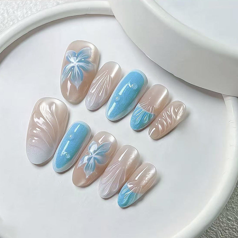 Tropical Oasis Medium Almond Press On Nail Set in Soft Beige and Sky Blue with Floral Accents