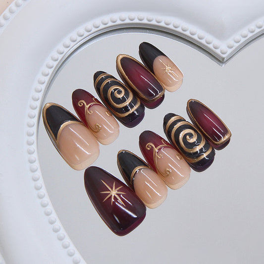 Celestial Elegance Medium Almond Burgundy and Black Press On Nail Set with Gold Swirl Designs