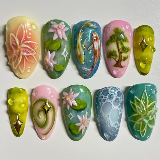 Whimsical Garden Fantasy Medium Almond Aqua and Pink Press on Nail Set with Floral and Nature-Inspired Accents
