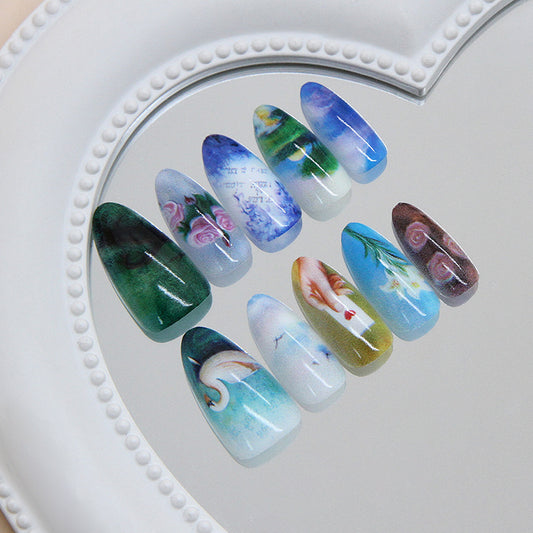 Whimsical Nature Inspired Long Almond Shaped Multi-Colored Nail Set Featuring Artistic Floral and Scenic Designs