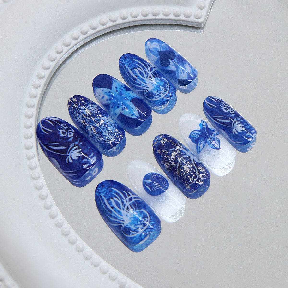 Mystical Ocean Blue Long Almond and Coffin Press-On Nail Set with Artful Designs and Glitter Accents