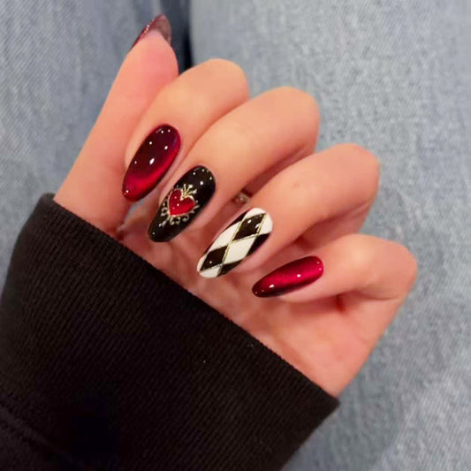 Gothic Elegance Long Oval Deep Red and Black Gradient Nails with Heart and Harlequin Design