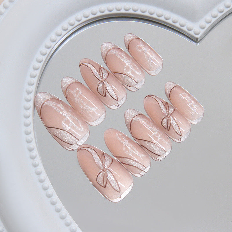 Whimsical Elegance Long Almond Pink Nails with Shimmering Bow Design
