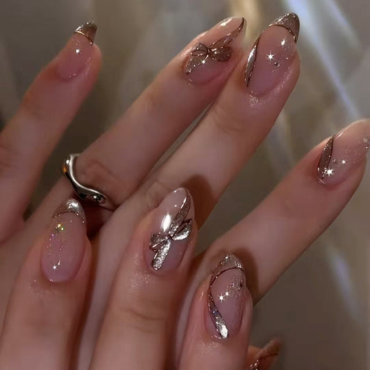 Enchanting Elegance Long Almond Beige Glossy Finish with Stunning Glittering Bow Accents