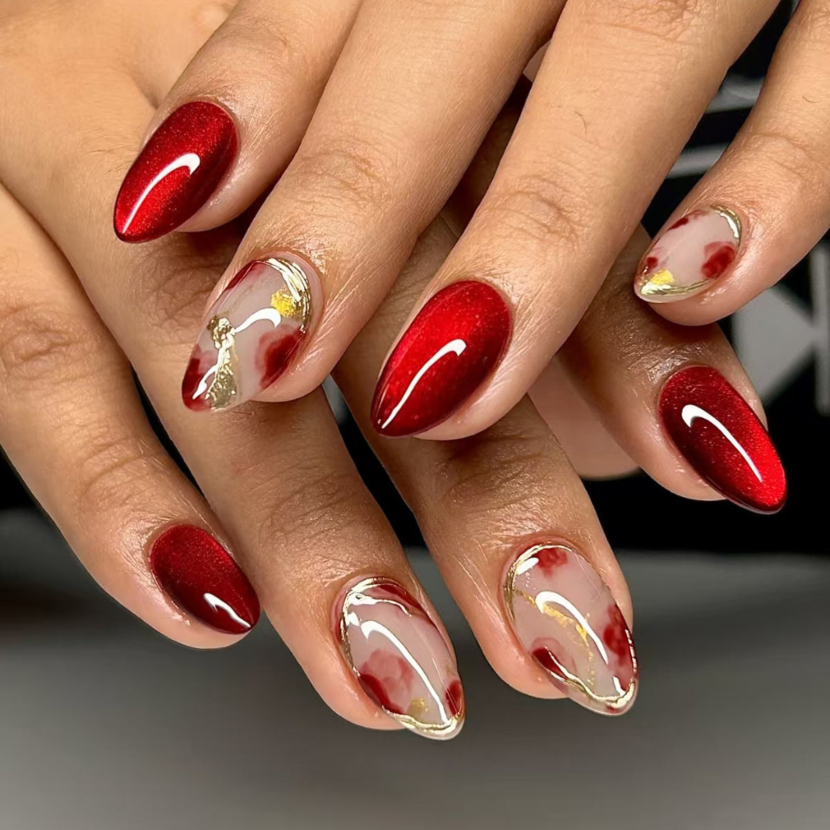 Glamorous Red Elegance Medium Almond Press On Nail Set with Artistic Marble Detail