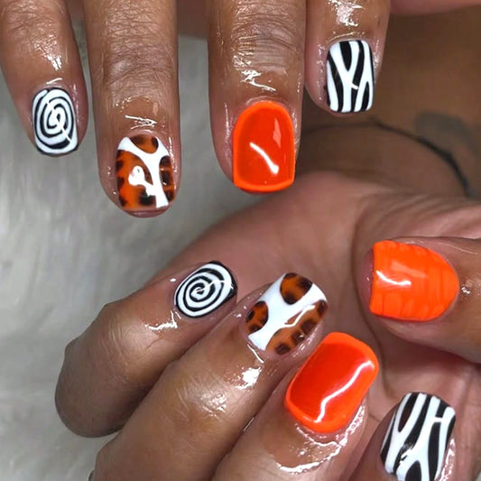 Vibrant Safari Short Square Nail Set in Bold Orange Swirls and Playful Animal Prints