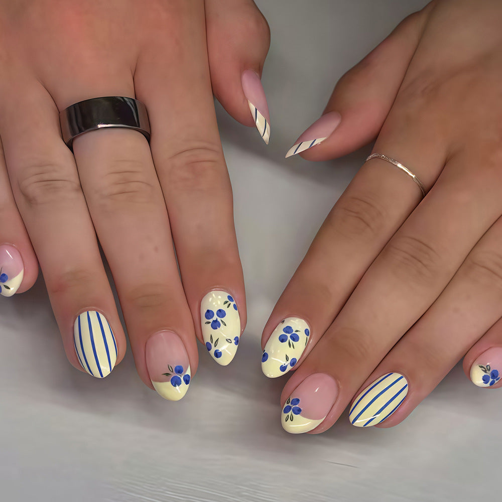 Whimsical Floral Delight Short Almond Yellow with Blue Floral Design and Striped Accents Press on Nail Set
