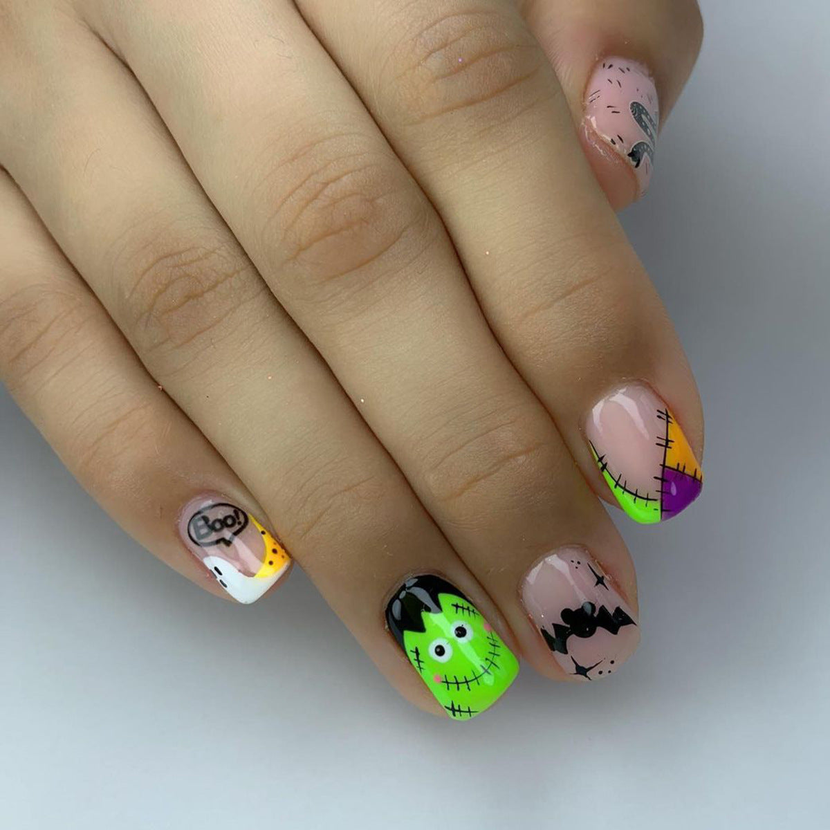Spooky Chic Short Oval Multicolor Halloween Themed Press On Nail Set with Artistic Character Designs