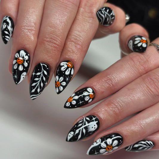 Spooky Floral Elegance Medium Almond Black and White Nail Set with Unique Ghost and Flower Designs