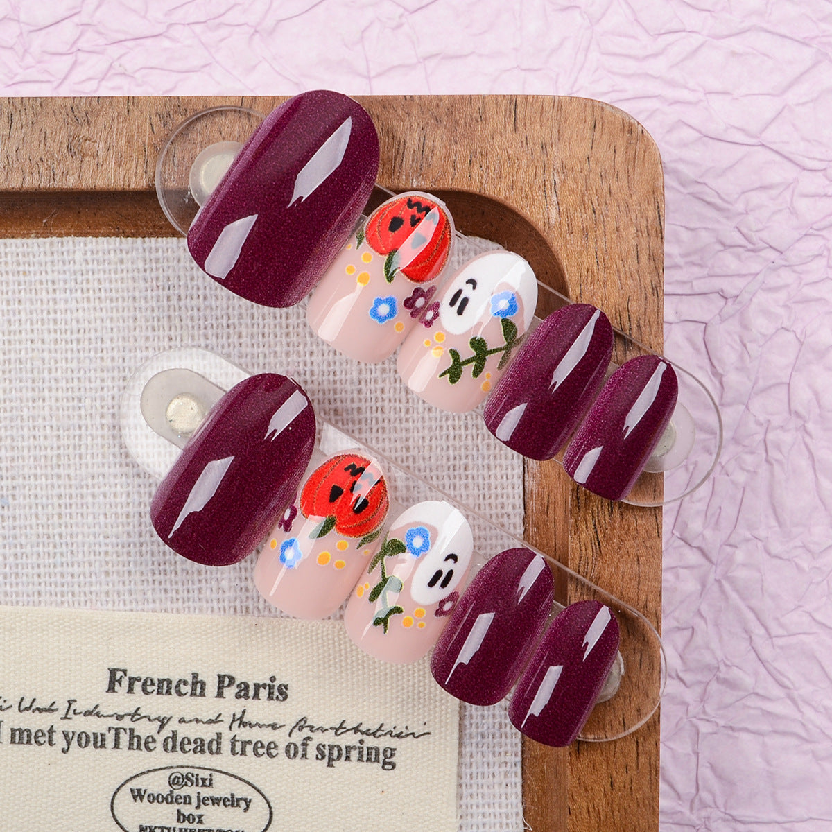 Enchanting Floral Medium Round Burgundy Press On Nail Set with Whimsical Hand-Painted Designs