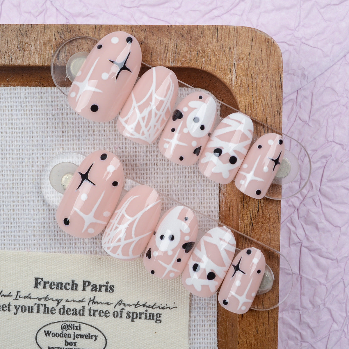 Spooky Chic Medium Oval Blush Pink Nail Set with Whimsical Spiderweb Design