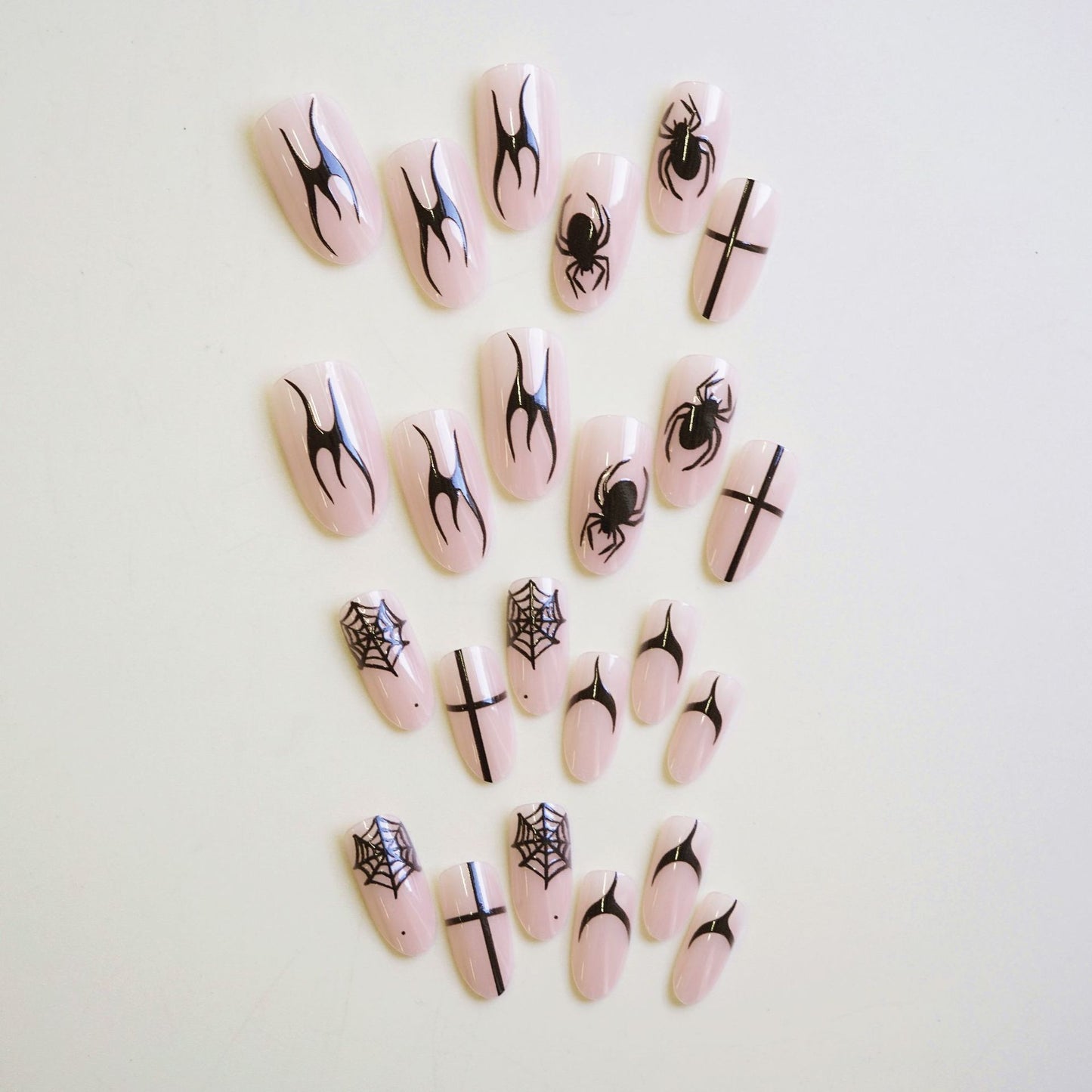 Spooky Elegance Long Almond Pink Press On Nail Set Featuring Intricate Black Spider and Spiderweb Designs