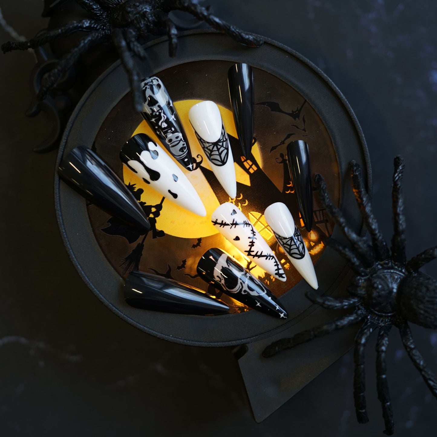 Spooky Halloween Themed Long Stiletto Black and White Press On Nail Set with Unique Spider Web and Skull Designs