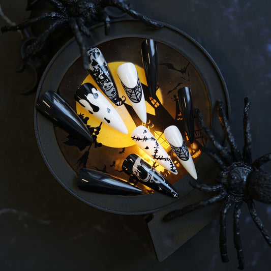 Spooky Halloween Themed Long Stiletto Black and White Press On Nail Set with Unique Spider Web and Skull Designs