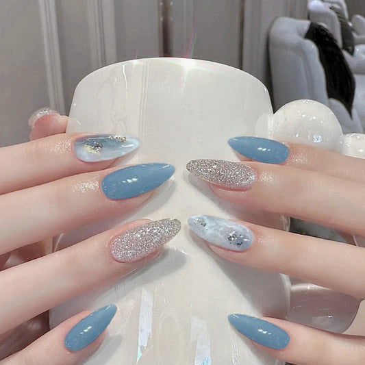Celestial Elegance Medium Almond Blue and Silver Glitter Press On Nail Set with Unique Artistic Marble Design