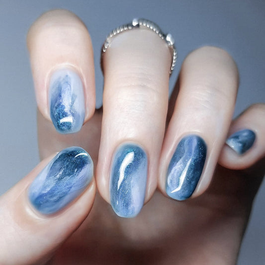Celestial Dream Blue Short Oval Press On Nail Set with Iridescent Swirl Finish