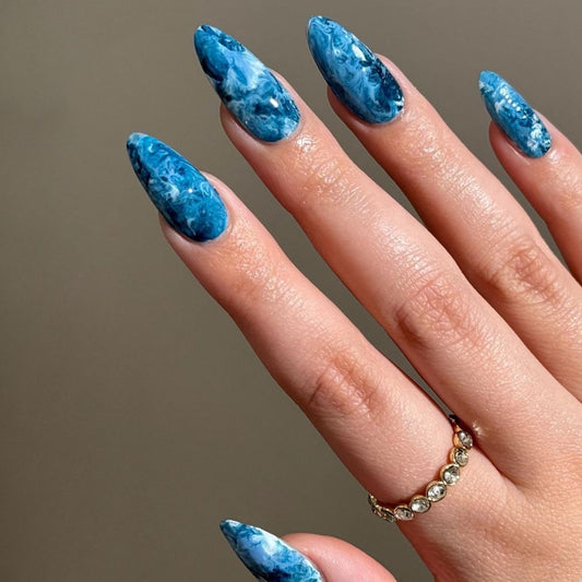 Oceanic Dream Medium Almond Shaped Blue Glossy Nail Set with Swirling Marble Effect