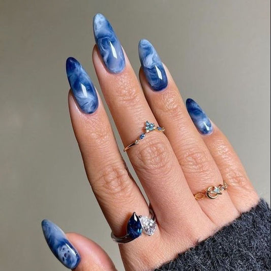 Celestial Dreams Medium Almond Sky Blue Marble Press On Nail Set with Glossy Finish