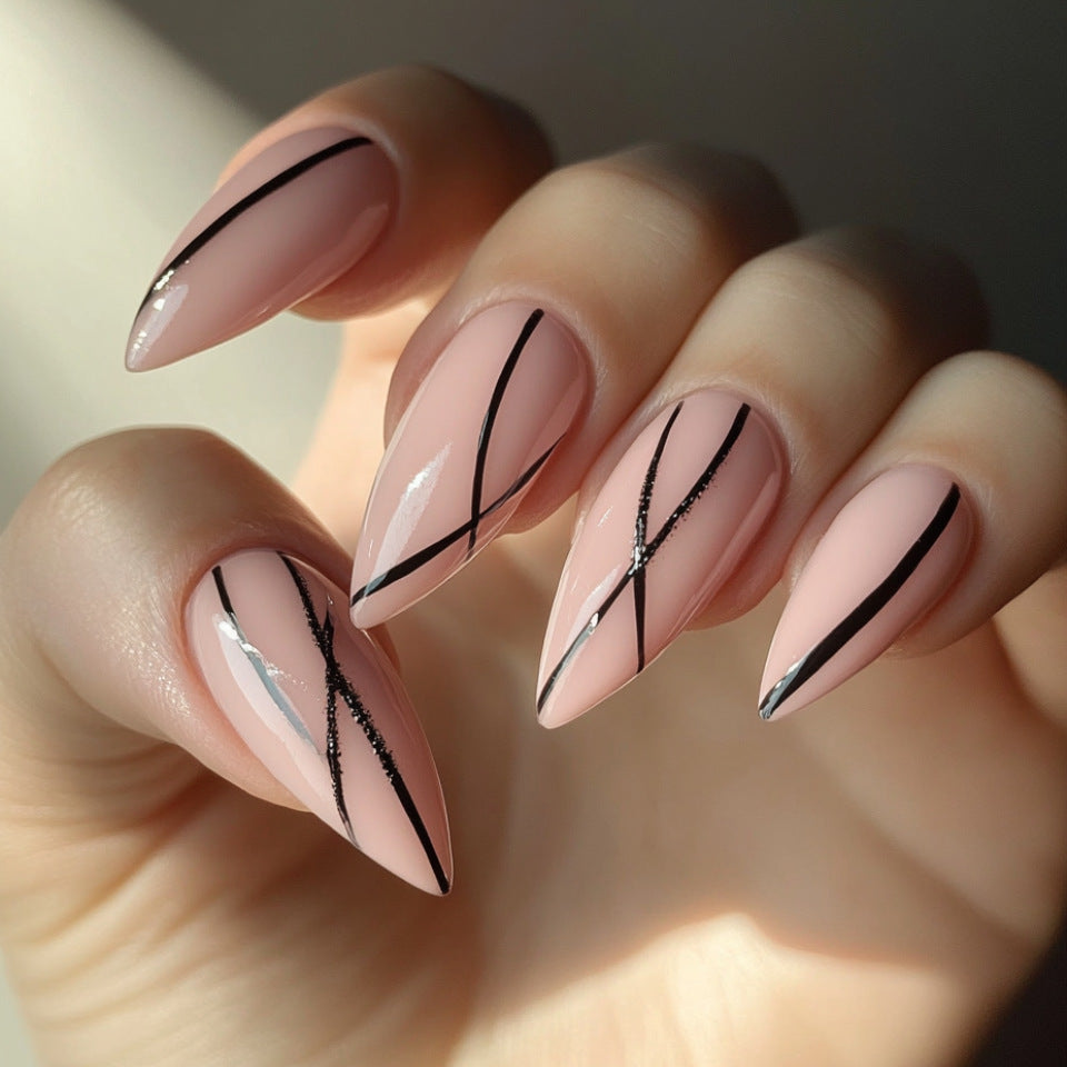 Chic Elegance Long Almond Pink Nails with Unique Black Striped Design