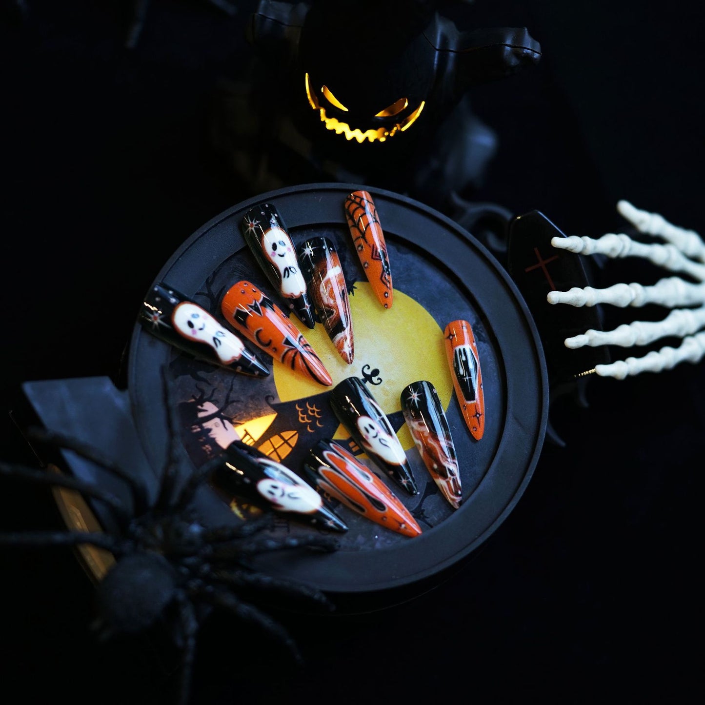 Spooktacular Long Almond Black and Orange Nail Set with Ghostly Design Features
