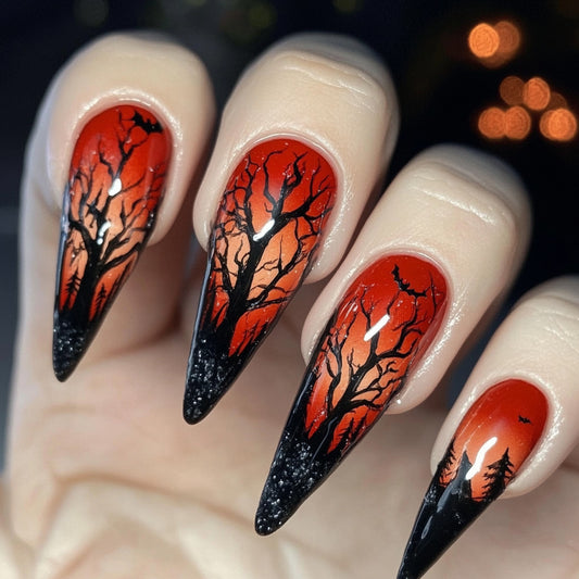 Spooky Twilight Long Stiletto Nails in Fiery Red and Black with Enchanting Forest Silhouette Design