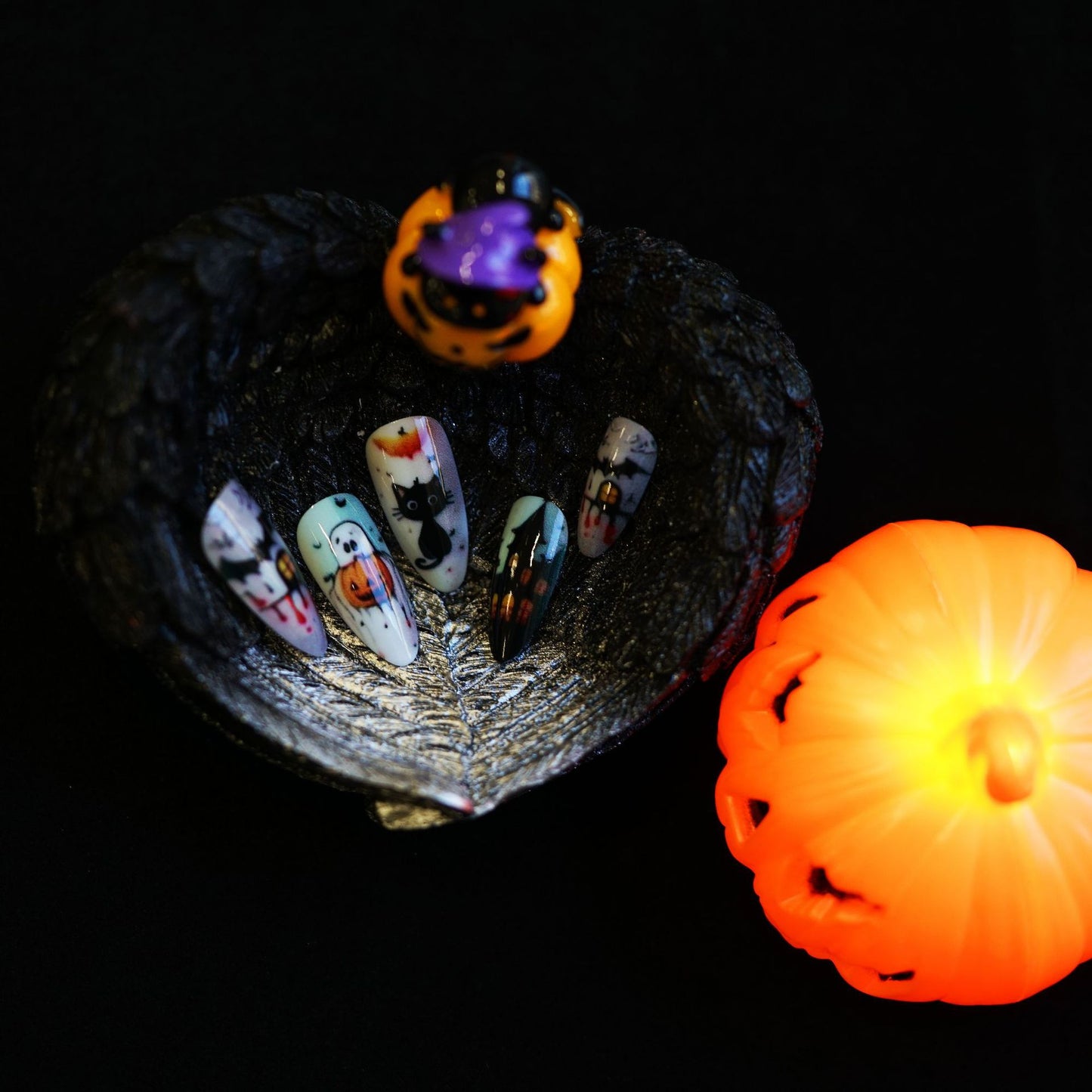 Spooktacular Autumn Inspired Medium Almond Orange and Black Press-On Nail Set with Halloween Designs