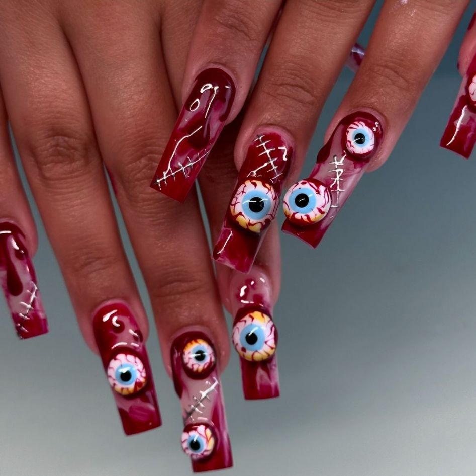 Spooky Glam Long Square Red Glossy Nails with Eyeball Art