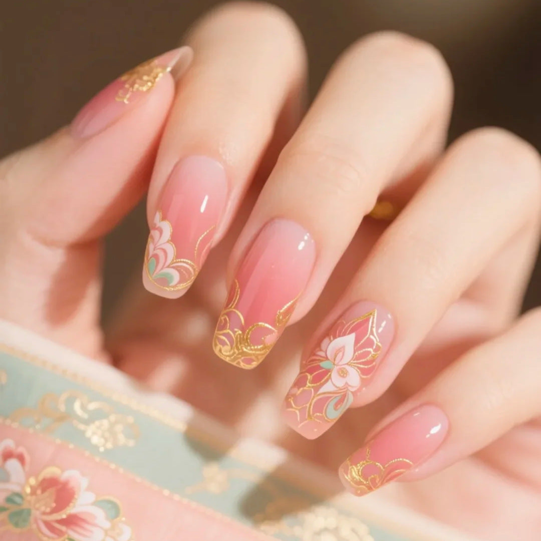 Elegant Blossom Inspired Long Coffin Shape Pink Press On Nail Set with Intricate Floral Gold Designs