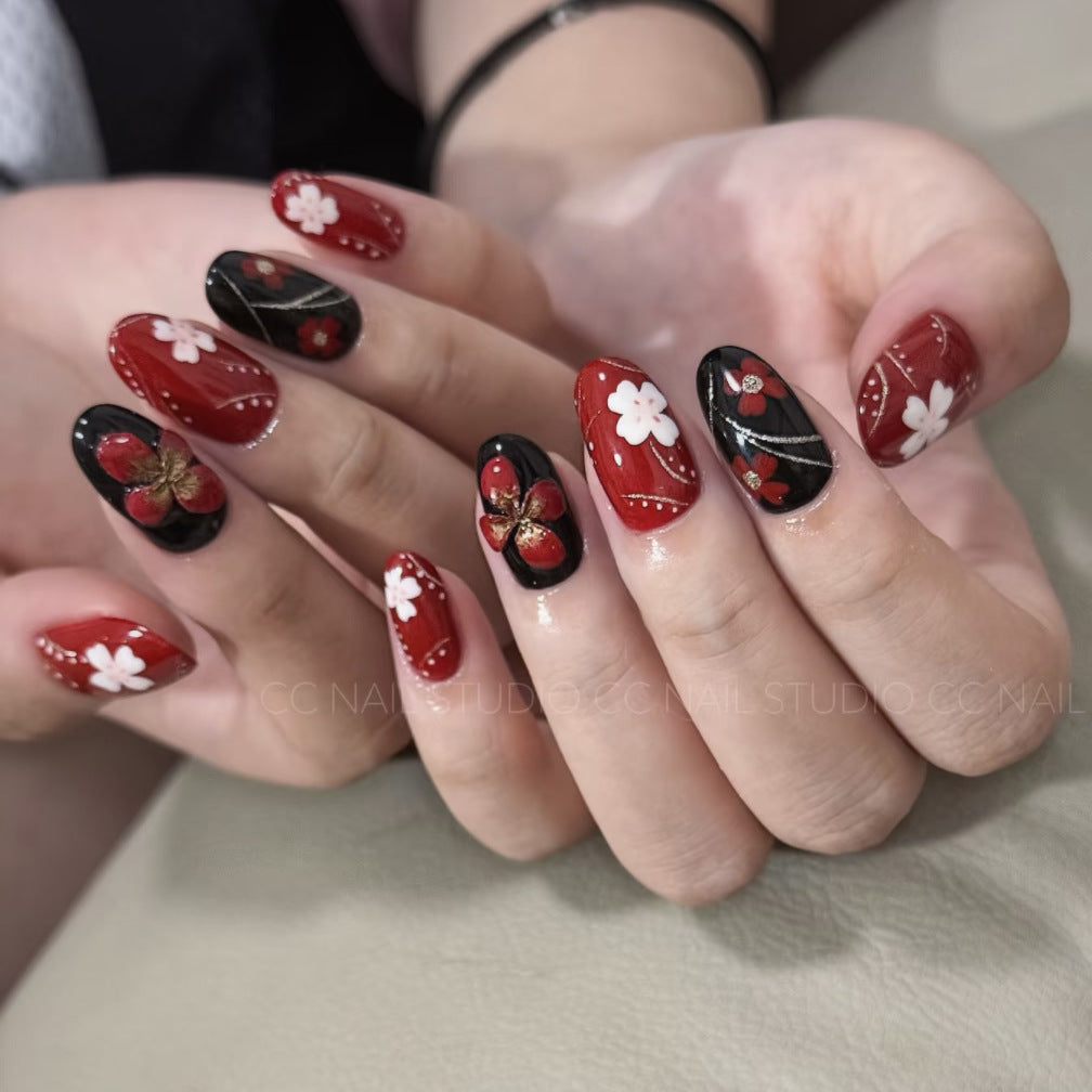 Elegant Blossom Fantasy Medium Almond Red and Black Floral Design with Golden Accents Press On Nail Set