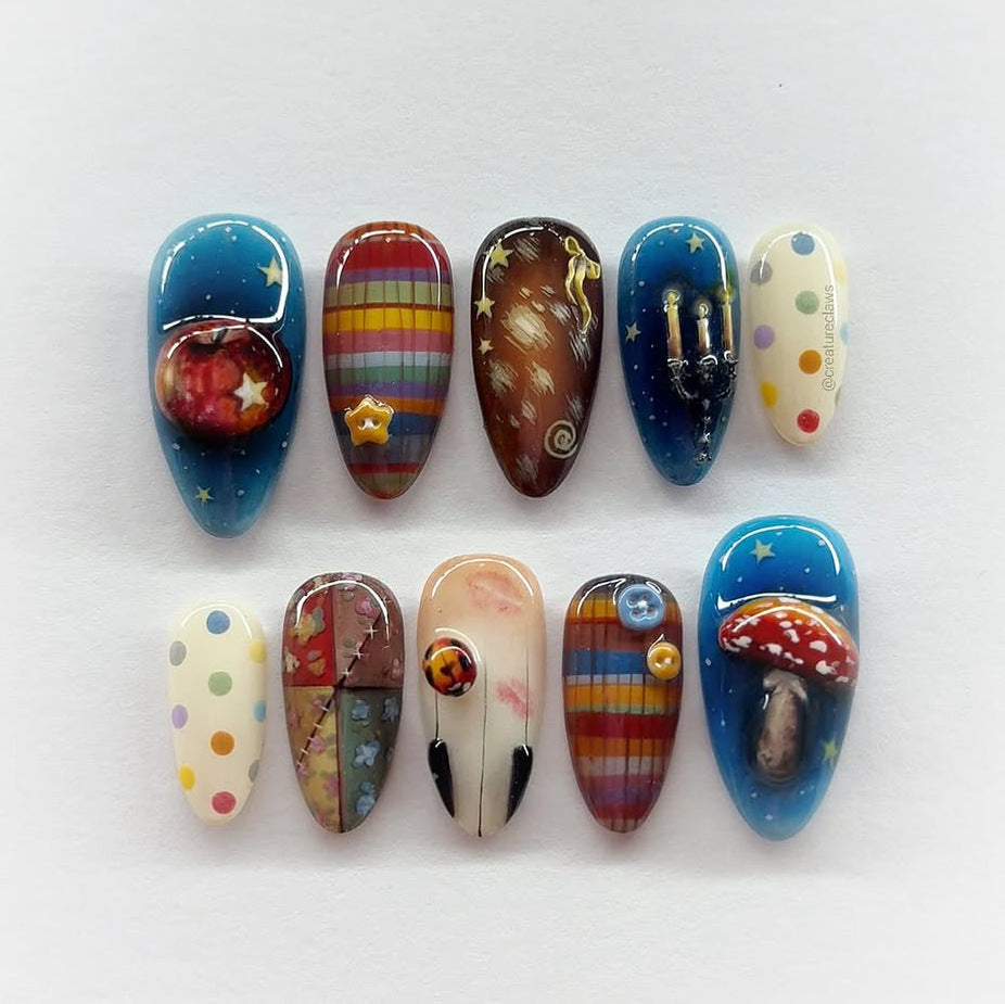 Celestial Wonder Long Almond Blue Press-On Nail Set Featuring Whimsical Space Designs and Vibrant Details