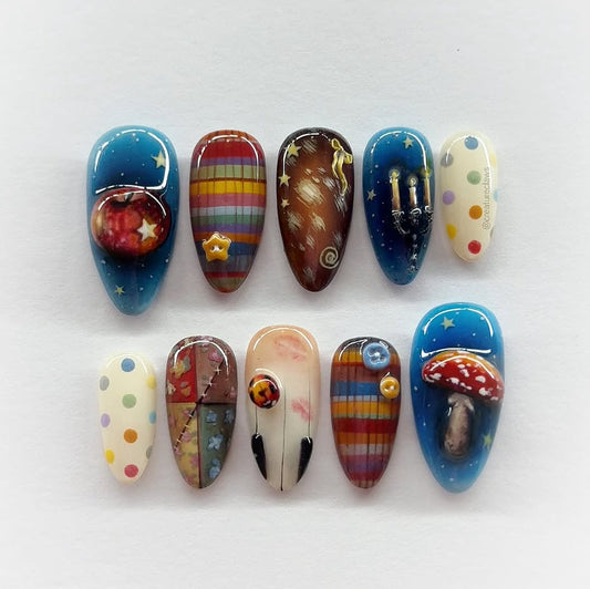 Celestial Wonder Long Almond Blue Press-On Nail Set Featuring Whimsical Space Designs and Vibrant Details
