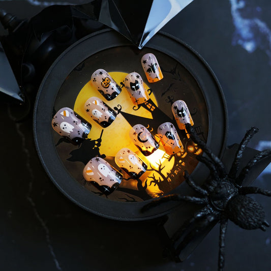 Hauntingly Elegant Medium Ovall Orange and Black Ghostly Halloween Press On Nail Set with Spooky Designs
