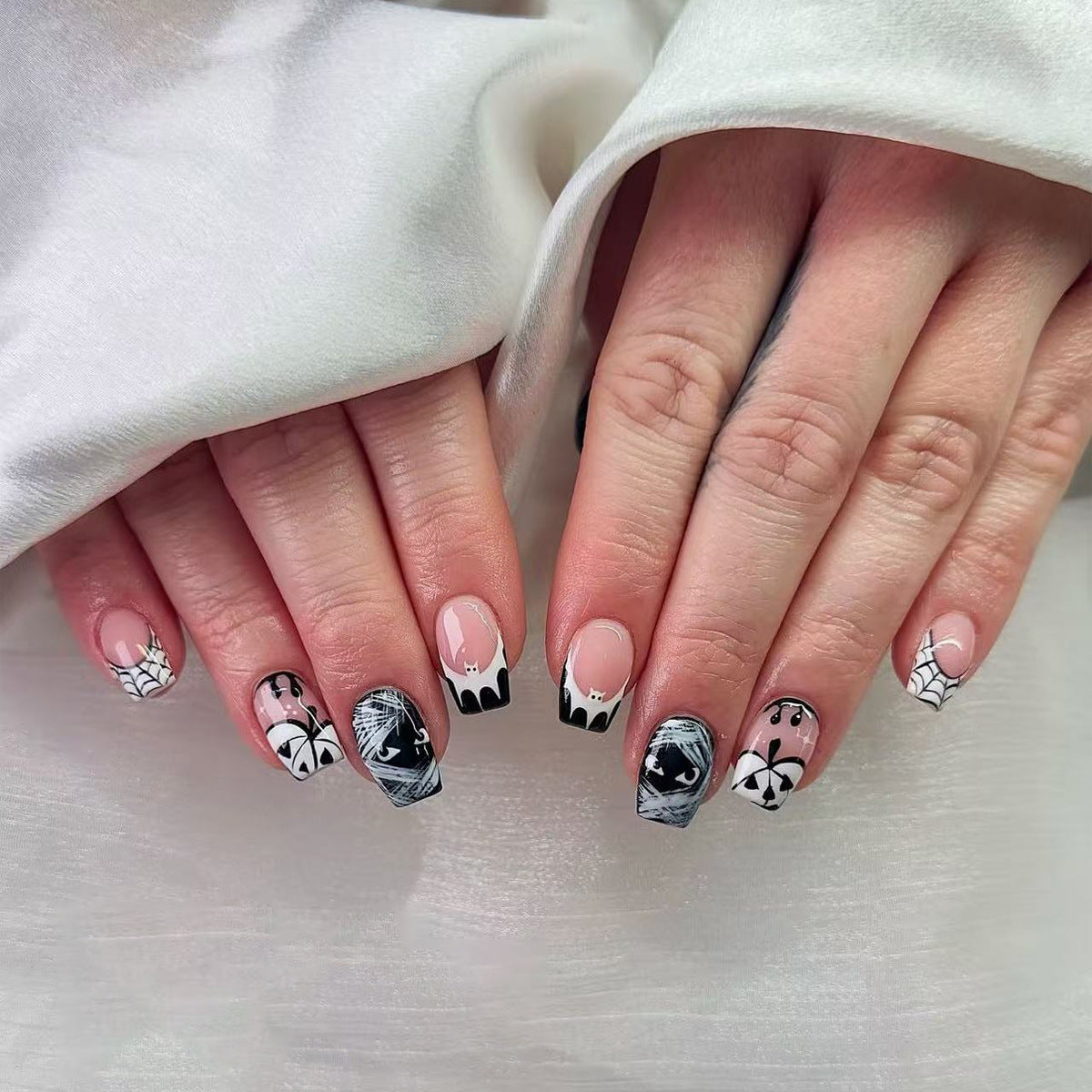 Spooky Glam Medium Square Black and White Nail Set with Unique Halloween Designs
