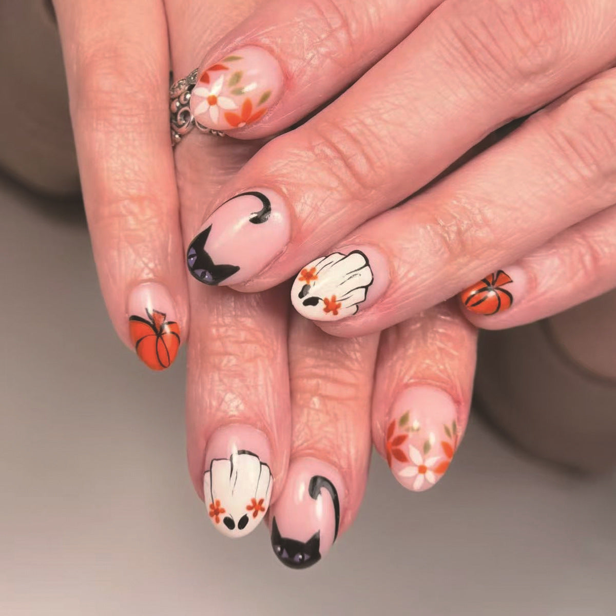 Spooky Autumn Short Almond Orange and Black Cat Nail Set with Floral Accents