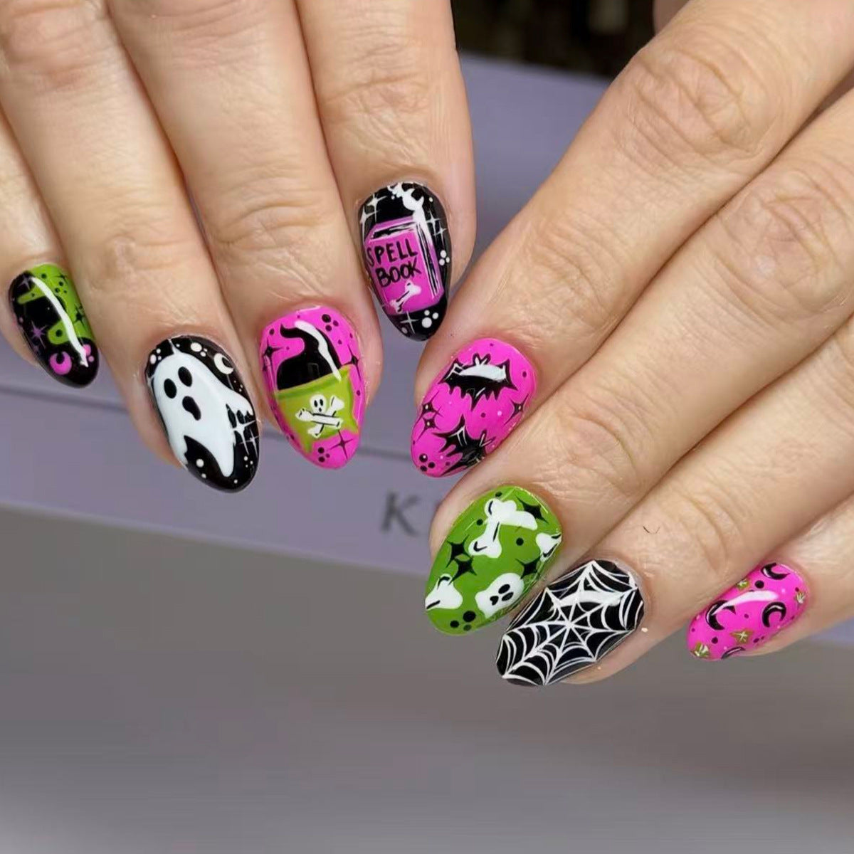 Spooky Charm Medium Almond Neon Nail Set with Fun Halloween Themed Designs