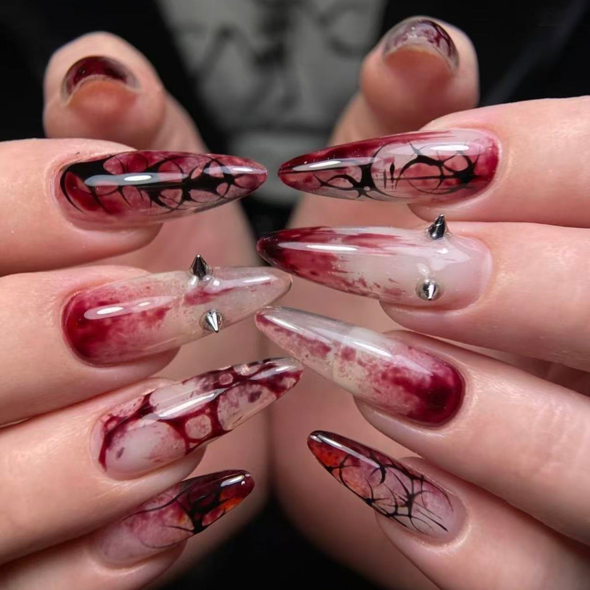 Gothic Elegance Long Almond Deep Red Nails with Unique Stud Accents