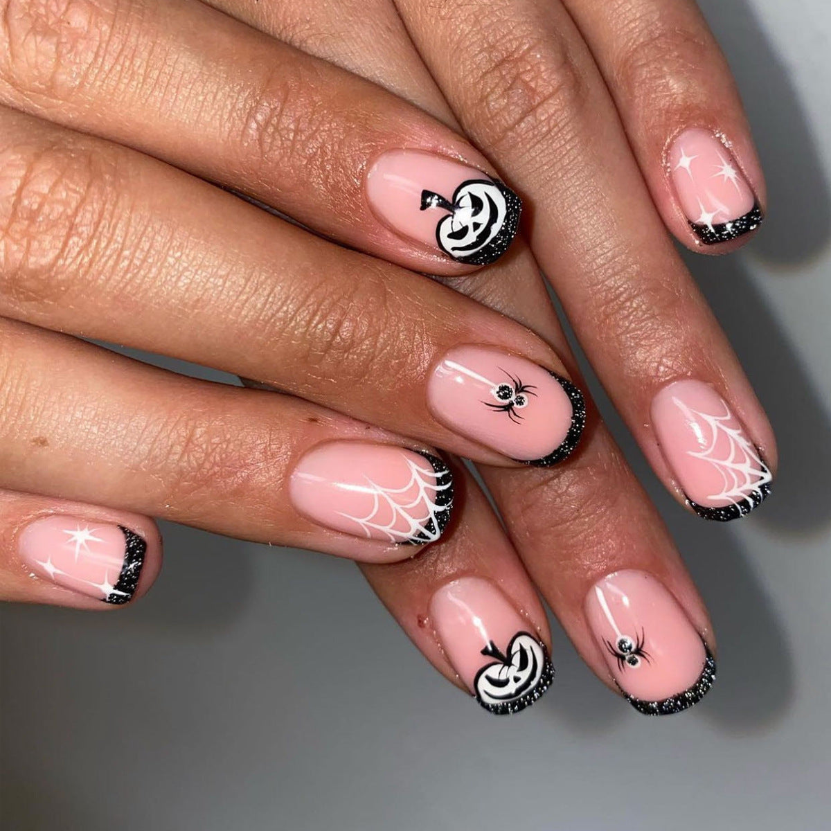 Spooky Elegance Short-Length Oval Pink Press On Nail Set with Spider Web Design