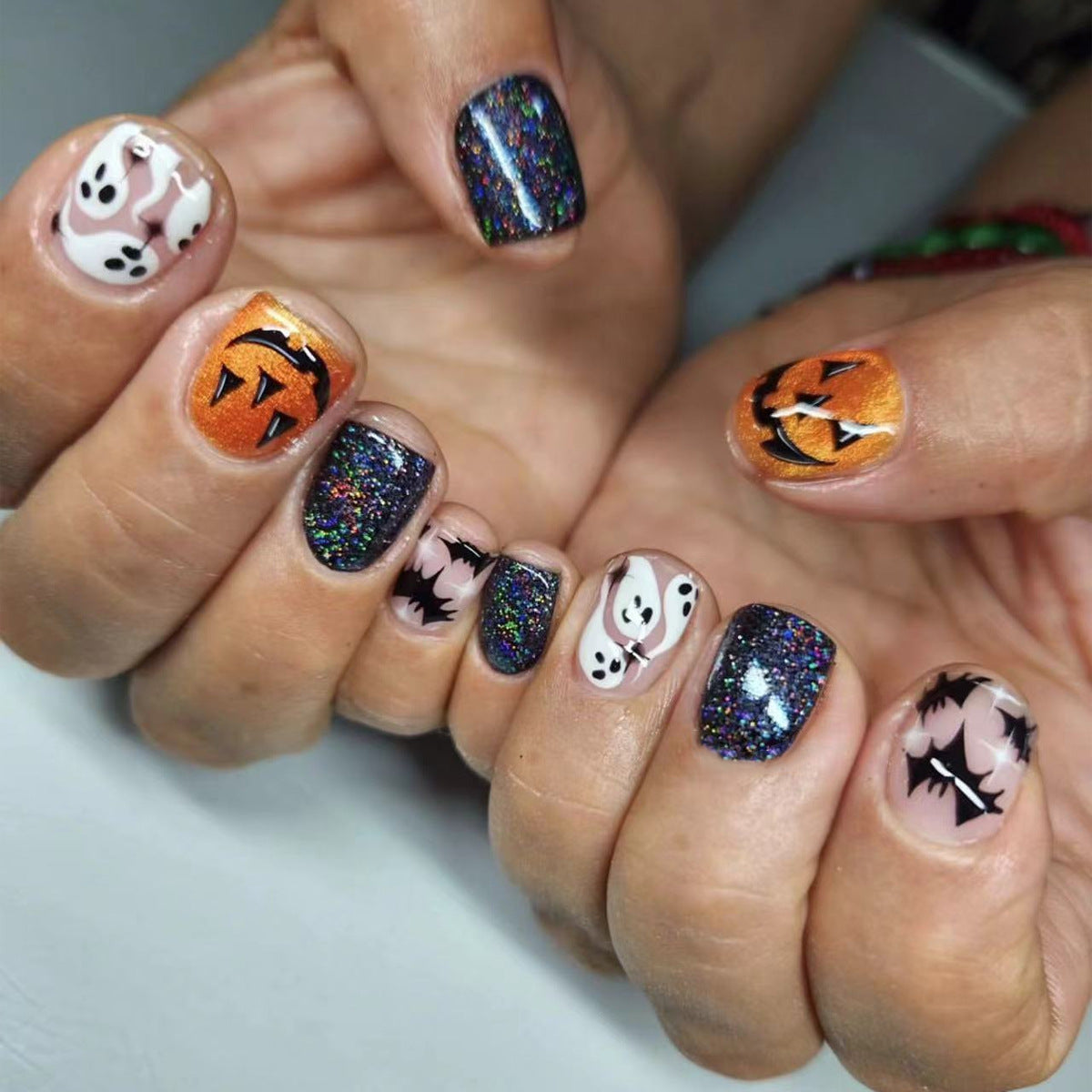 Spooky Elegance Short Oval Multicolor Glitter Halloween Press On Nail Set with Ghost and Pumpkin Designs