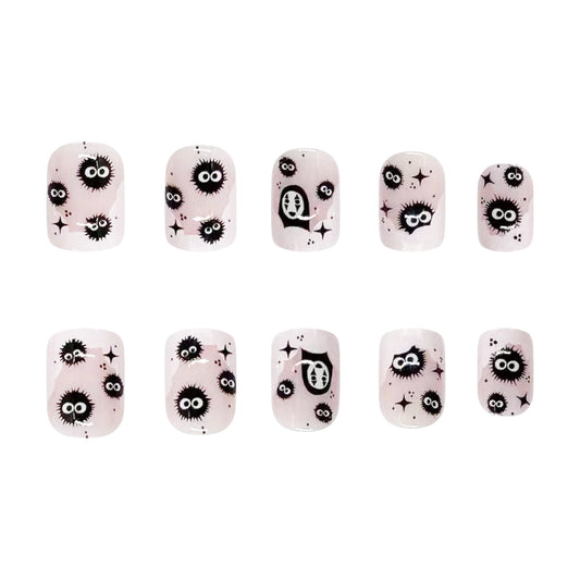 A set of twelve press-on nails with bold eyeball accents, featuring a variety of spooky and elegant designs, predominantly in shades of pink and black.