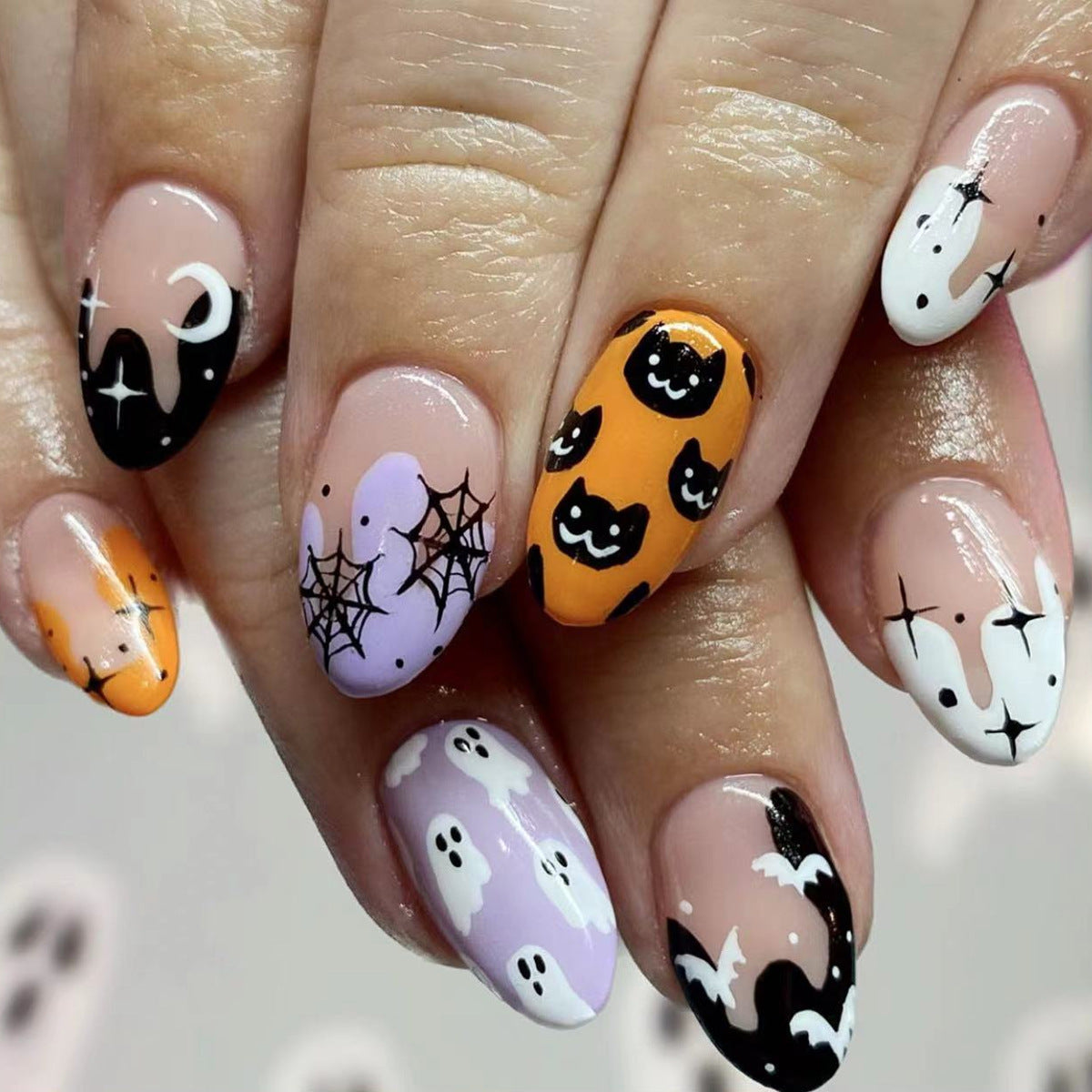 Spooky Elegance Medium Length Oval Press On Nails in Black Orange and White with Halloween Art Design