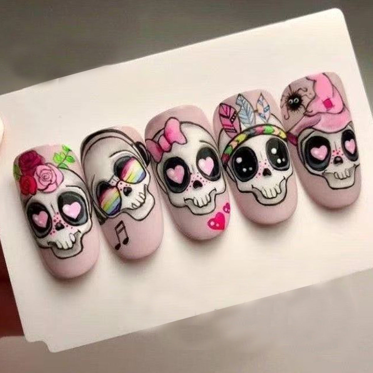 Day of the Dead Inspired Medium Oval Pink Skull Press On Nail Set with Colorful Illustrations and Unique Personality