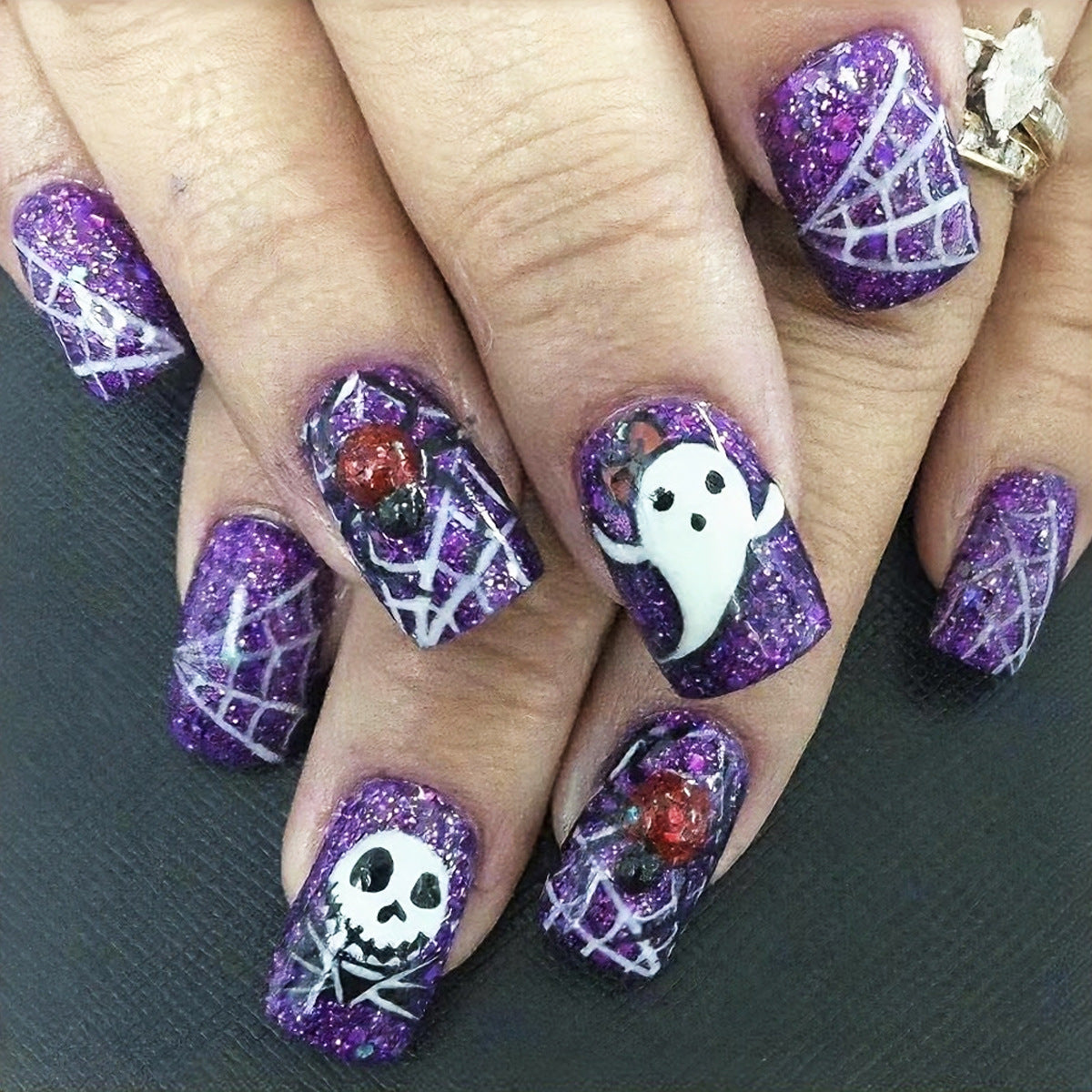 Haunting Glamour Short Oval Purple Glitter Press-On Nail Set with Whimsical Spider and Ghost Designs