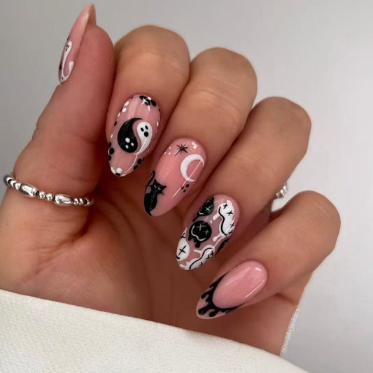 Spooky Chic Medium Oval Shaped Pink and Black Artistic Press On Nail Set with Whimsical Design Elements